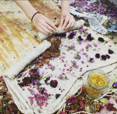 layers of fabric being dyed with flower petals