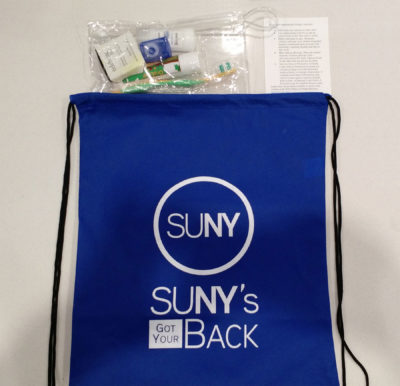 SUNY's Got Your Back backpack with toiletries coming out of the top