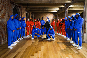 dance team in red and blue track suite