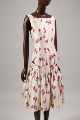 mannequin wearing white dress with pink flowers
