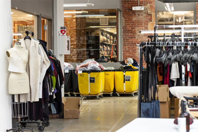 warehouse will laundry baskets filled with textiles