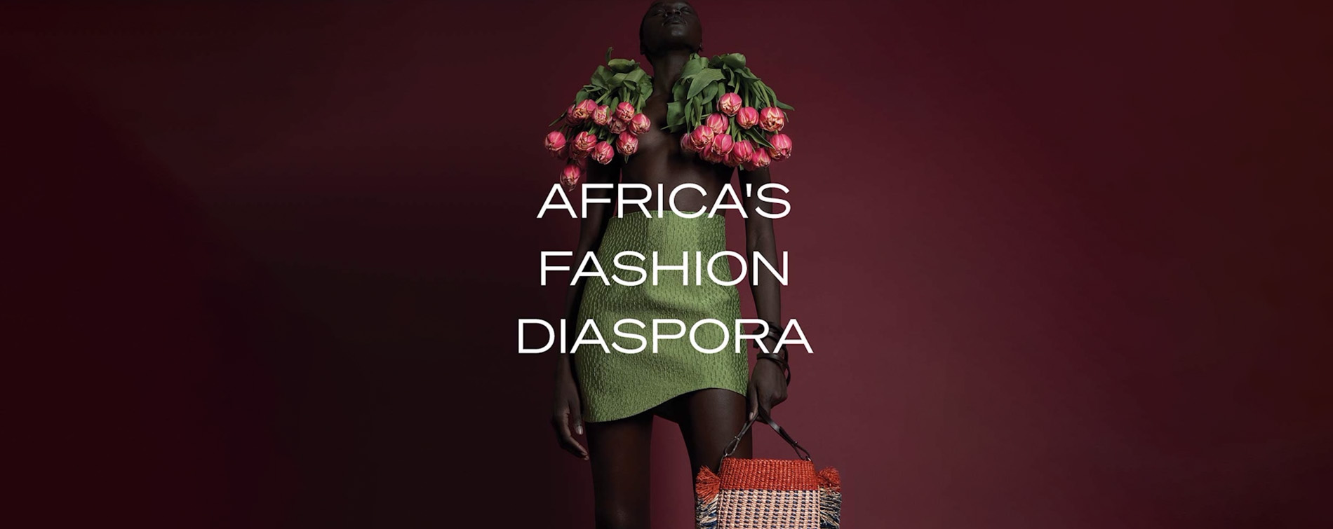 dark skinned mannequin with tulips around shoulders and green dress; Africa's Fashion Diaspora text