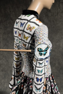 back of dress on mannequin with panels of different colored butterflies