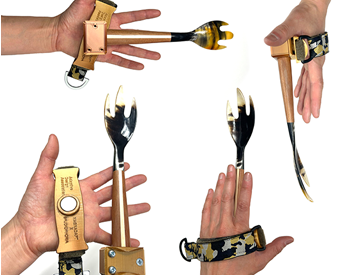 hands holding fork-like objects