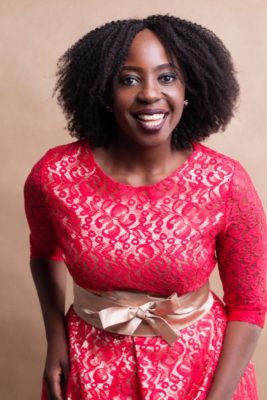Connie Aluoch in a pink dress