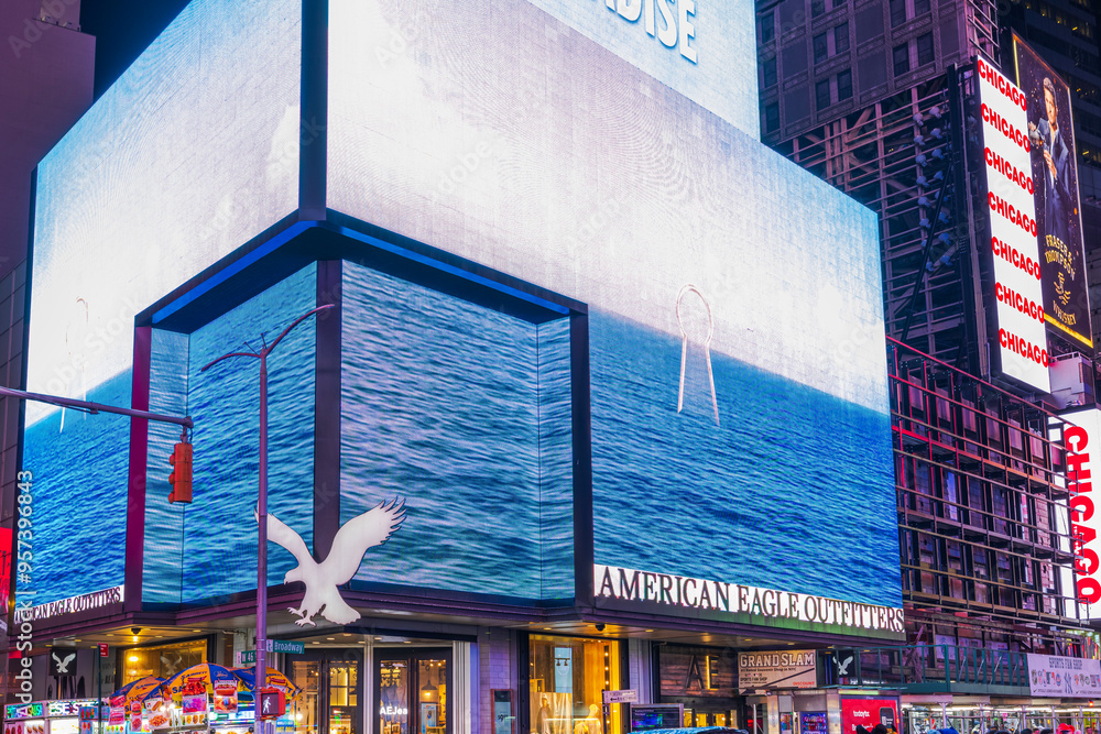americaneagle digital sign wrapping around an American Eagle Outfitters storefront showing a blue ocean with a white eagle