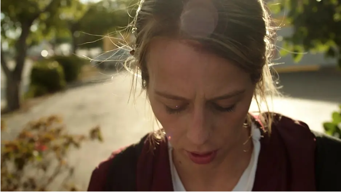 woman with a downturned face