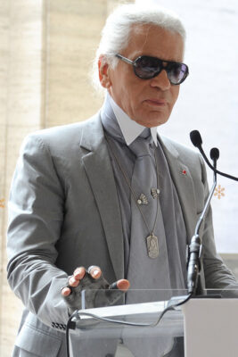 Karl Lagerfeld at a podium