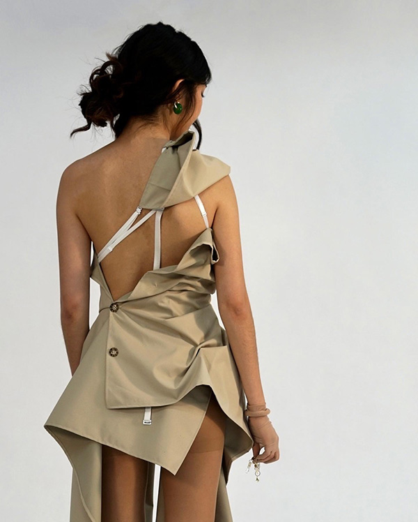 model in strappy khaki dress